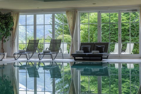 Indoor pool, open 8:00 AM to 9:30 PM, pool umbrellas, sun loungers