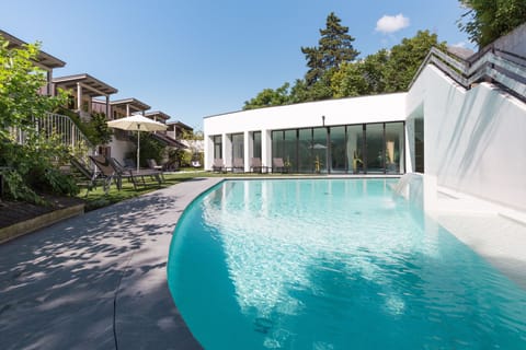 Indoor pool, seasonal outdoor pool, pool umbrellas, sun loungers