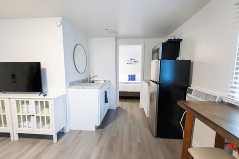 Traditional Suite | Private kitchen | Microwave, coffee/tea maker, cleaning supplies