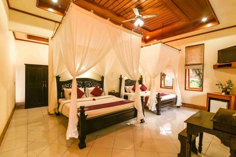 Family Suite with Garden View | Egyptian cotton sheets, minibar, in-room safe, desk