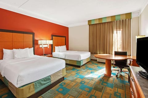 Premium bedding, desk, iron/ironing board, free cribs/infant beds