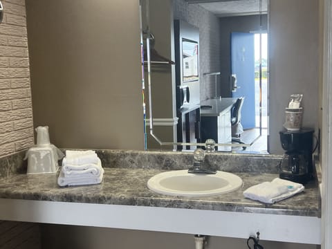 Combined shower/tub, hair dryer, towels, soap