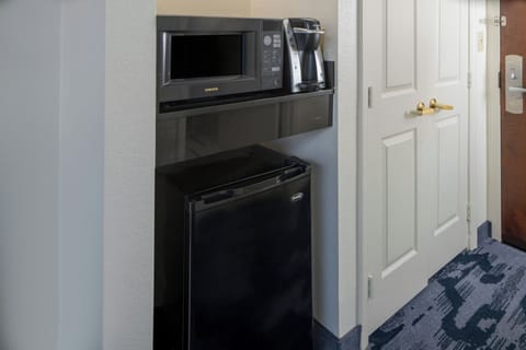 Premium bedding, desk, laptop workspace, blackout drapes