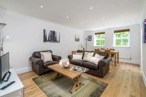 Apartment, 2 Bedrooms | Living area | 24-inch TV with cable channels