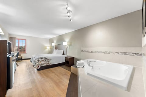 Standard Suite, 1 King Bed, Non Smoking, Jetted Tub | In-room safe, desk, laptop workspace, blackout drapes