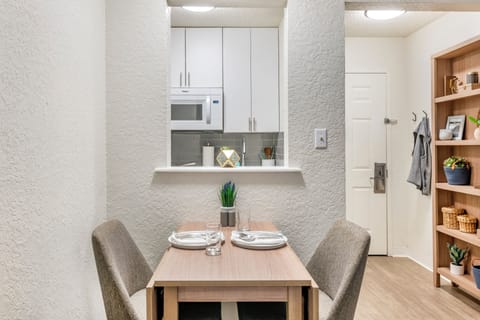 Fridge, microwave, stovetop, dining tables