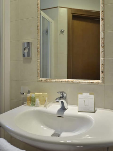 Designer toiletries, hair dryer, slippers, bidet