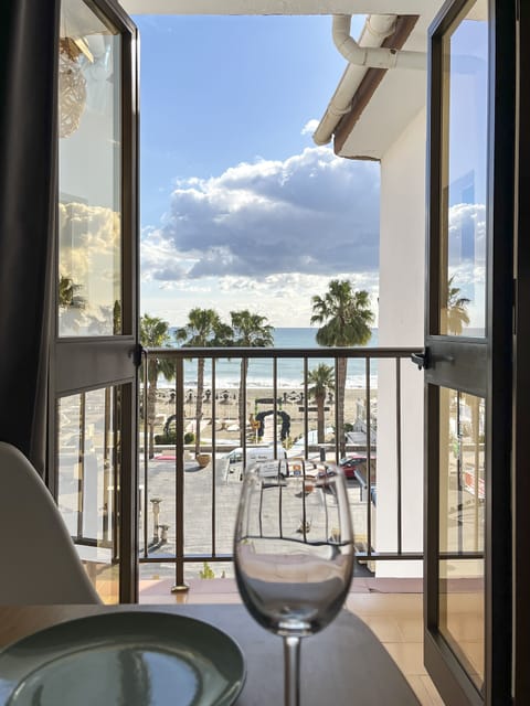 Studio, Partial Sea View | Minibar, desk, laptop workspace, blackout drapes