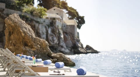 On the beach, sun loungers, beach umbrellas, beach towels