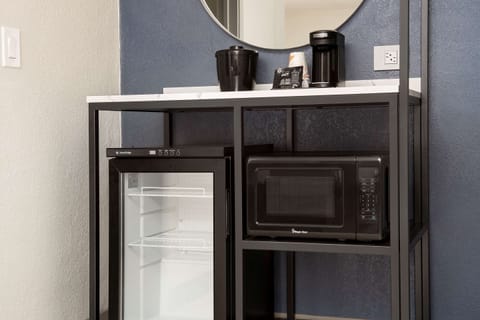 Desk, laptop workspace, blackout drapes, iron/ironing board