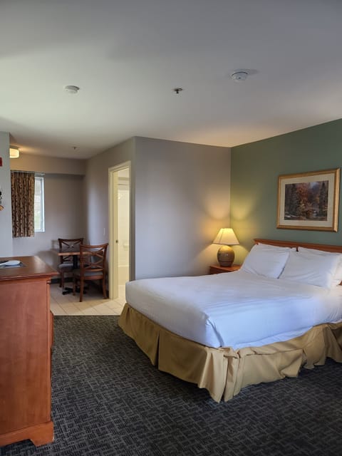 Premium bedding, Tempur-Pedic beds, desk, laptop workspace