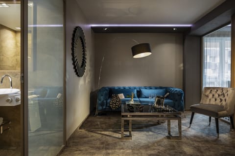 Deluxe Studio Suite, Balcony | Living area | 110-cm Smart TV with satellite channels, TV