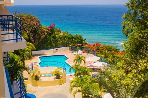 Outdoor pool, a waterfall pool, free cabanas, pool umbrellas