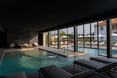 Indoor pool, outdoor pool, pool umbrellas, sun loungers