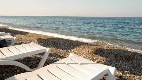 On the beach, white sand, beach shuttle, sun loungers