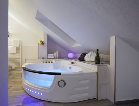 Adventure Double Room | Bathroom | Eco-friendly toiletries, hair dryer, slippers, towels