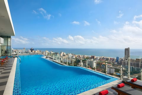 Outdoor pool, open 7:00 AM to 9:00 PM, sun loungers