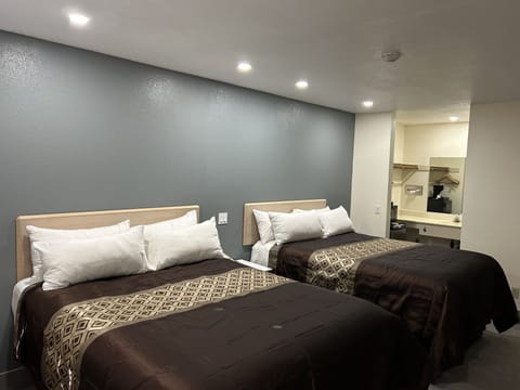 Standard Room, 2 Queen Beds, Non Smoking | Desk, iron/ironing board, cribs/infant beds, rollaway beds