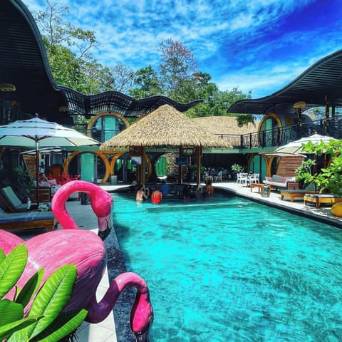 2 outdoor pools, open 8:00 AM to 10:00 PM, pool umbrellas