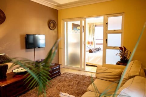 Orchid Luxury Suite | Living room | Plasma TV, DVD player