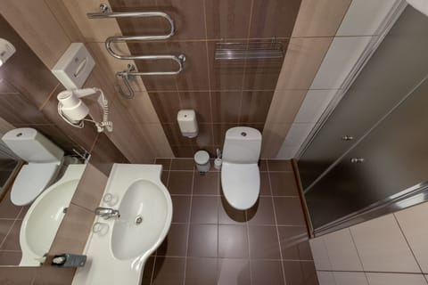 Shower, hair dryer, slippers, towels