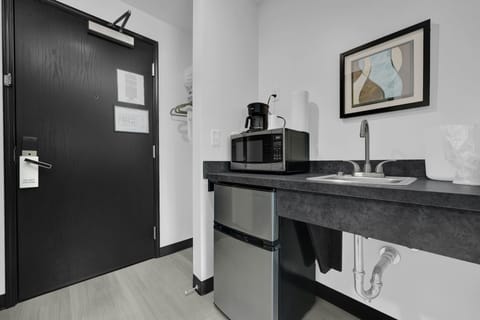 Down comforters, desk, laptop workspace, bed sheets