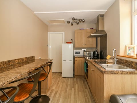 Fridge, electric kettle, toaster, cookware/dishes/utensils