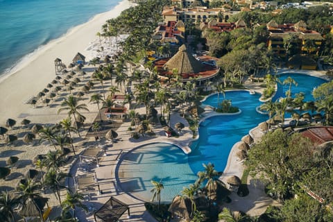 On the beach, white sand, sun loungers, beach umbrellas