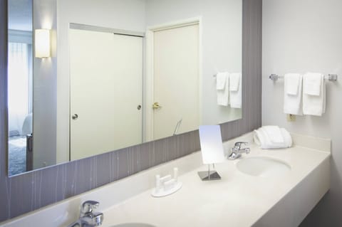Suite, 1 King Bed with Sofa bed, Balcony | Bathroom | Combined shower/tub, free toiletries, hair dryer, towels
