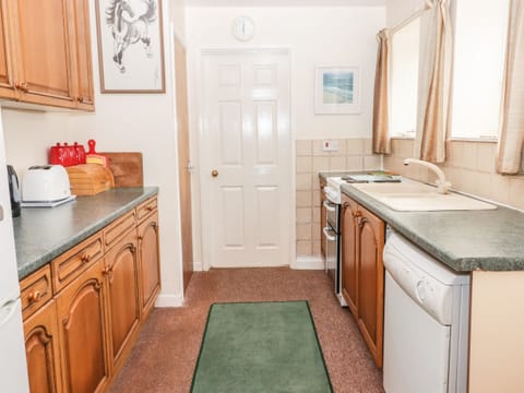 Fridge, electric kettle, cookware/dishes/utensils