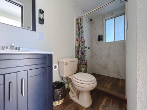 Shower, rainfall showerhead, towels, soap