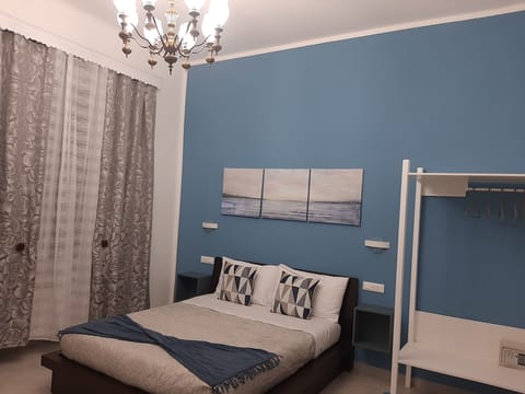 Family Quadruple Room, Non Smoking | Down comforters, in-room safe, desk, laptop workspace