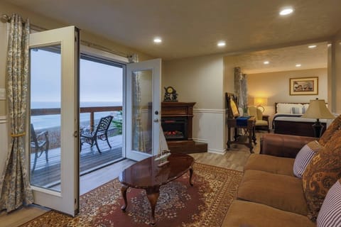 Victorian King Suite with Ocean view large Balcony/Deck | Living area | 32-inch flat-screen TV with satellite channels, TV, fireplace