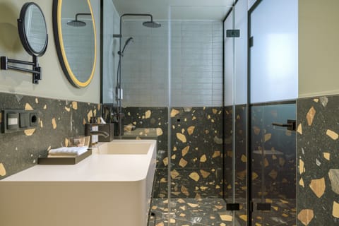 Shower, rainfall showerhead, hair dryer, towels