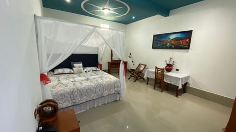 Deluxe Single Room, 1 King Bed, Private Bathroom, Pool View | Individually decorated, individually furnished, laptop workspace