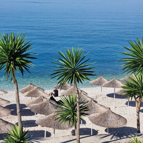 Private beach, white sand, sun loungers, beach umbrellas