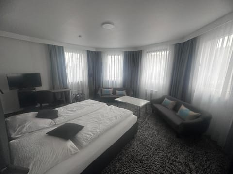 Family Triple Room, Multiple Beds, River View | In-room safe, desk, laptop workspace, free WiFi