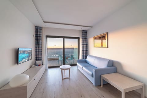 Suite, Sea View | Minibar, in-room safe, desk, laptop workspace