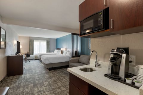 Blackout drapes, iron/ironing board, free cribs/infant beds