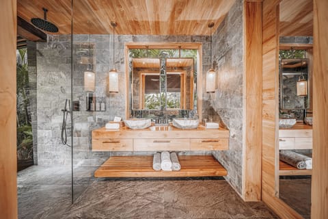 Separate tub and shower, rainfall showerhead, eco-friendly toiletries