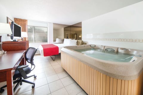 Suite, 1 King Bed, Non Smoking, Hot Tub | Desk, laptop workspace, blackout drapes, iron/ironing board