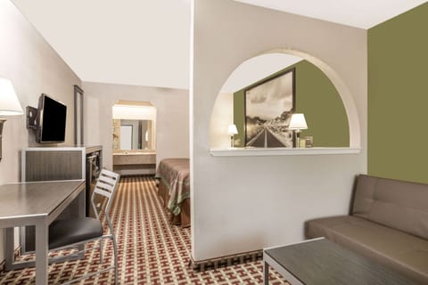 Suite, 1 King Bed, Smoking (Mini-Suite, First Floor) | Premium bedding, down comforters, pillowtop beds, desk