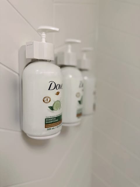 Combined shower/tub, hair dryer, towels, soap