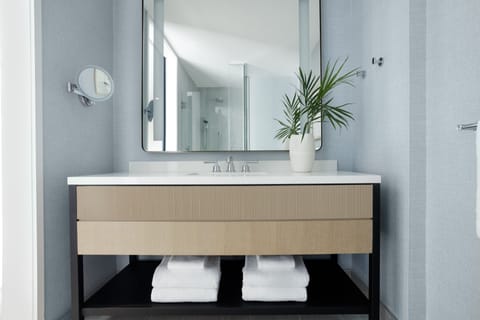 Designer toiletries, hair dryer, bathrobes, towels