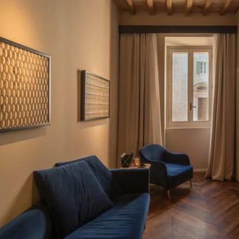 Luxury Studio Suite | Living area | 40-inch flat-screen TV with digital channels, TV