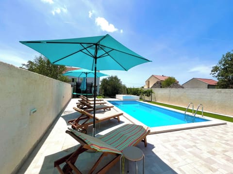 Seasonal outdoor pool, pool umbrellas, sun loungers