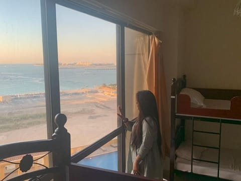 Design Shared Dormitory, Mixed Dorm, Jetted Tub, Beach View | Desk, laptop workspace, blackout drapes, iron/ironing board