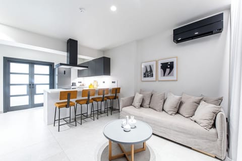 Superior Suite  with Outdoor Jetted Tub | Living area | 32-inch TV with satellite channels, pay movies