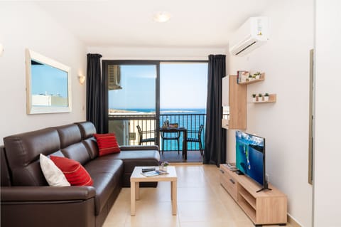 Standard Apartment, 1 Bedroom, Partial Ocean View | Living area | 43-inch LCD TV with satellite channels, TV