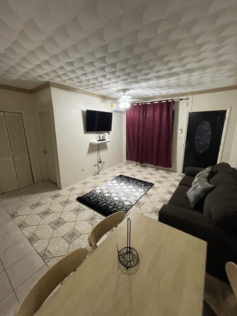 Basic Triple Room | Living area | 50-inch Smart TV with cable channels, TV